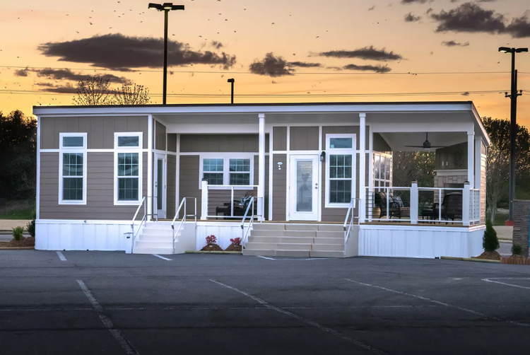 A tiny home with a porch and two entrances.